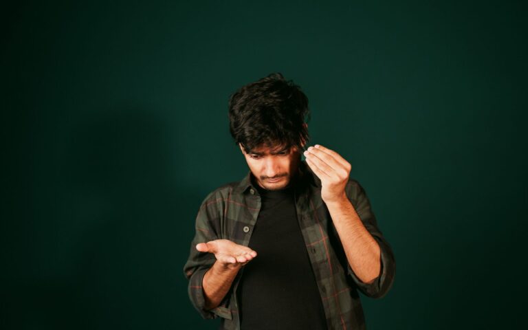 Young man examining his hair