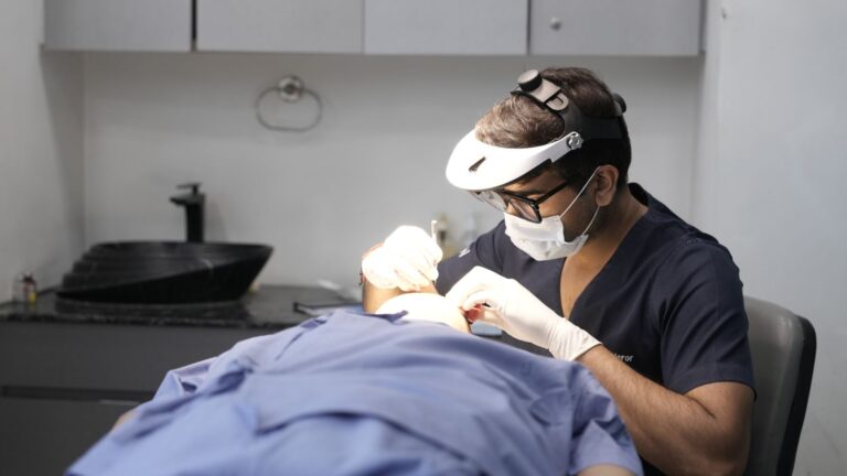 Dermatologist treating a patient