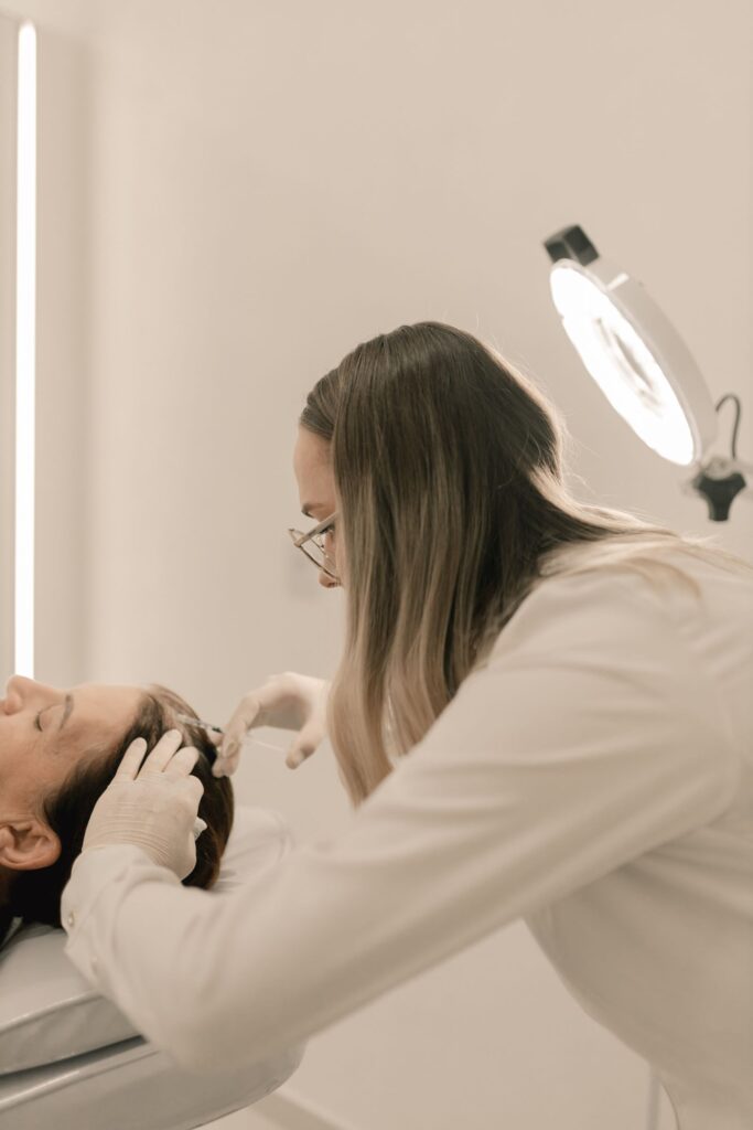 Specialist performing a treatment in a clinic